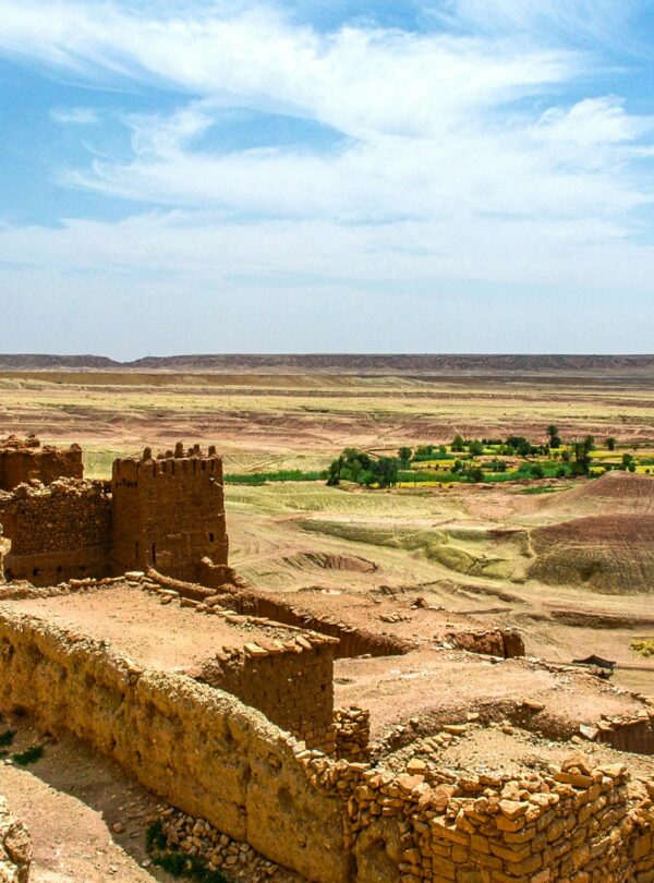 Explore the majestic ruins of a fortress amidst the arid landscapes of Zagora, Morocco.